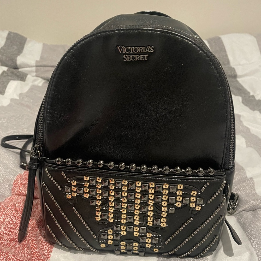 Victoria’s secret black mini backpack with sequins and studs.